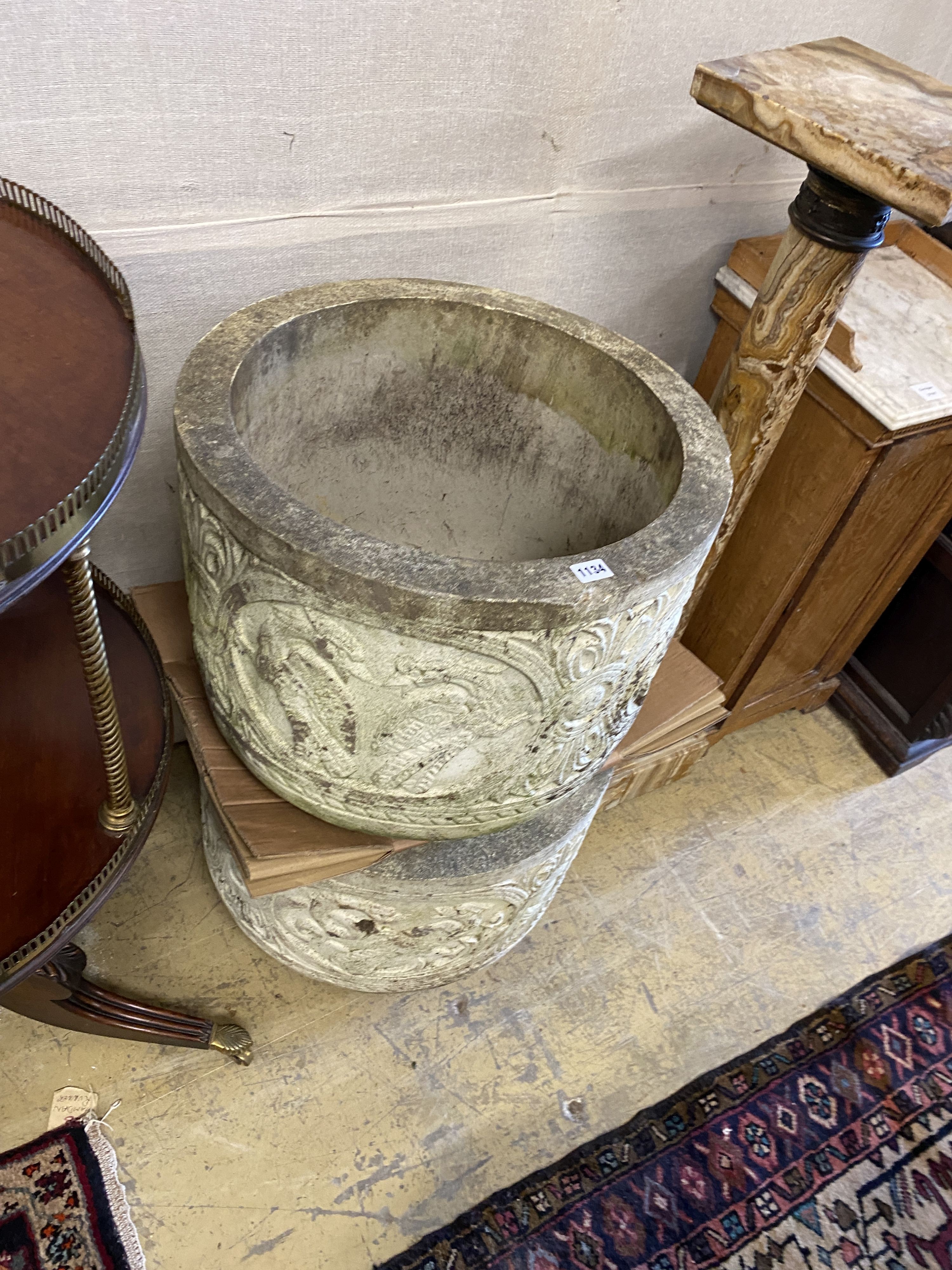 A pair of reconstituted stone circular garden planters, diameter 54cm, height 42cm